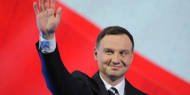 Candidate of Poland's main conservative opposition party Law and Justice in the May presidential elections, Andrzej Duda, greets supporters during a festive opening of his campaign in Warsaw, Poland, Saturday, Feb. 7, 2015. (AP Photo/Alik Keplicz)